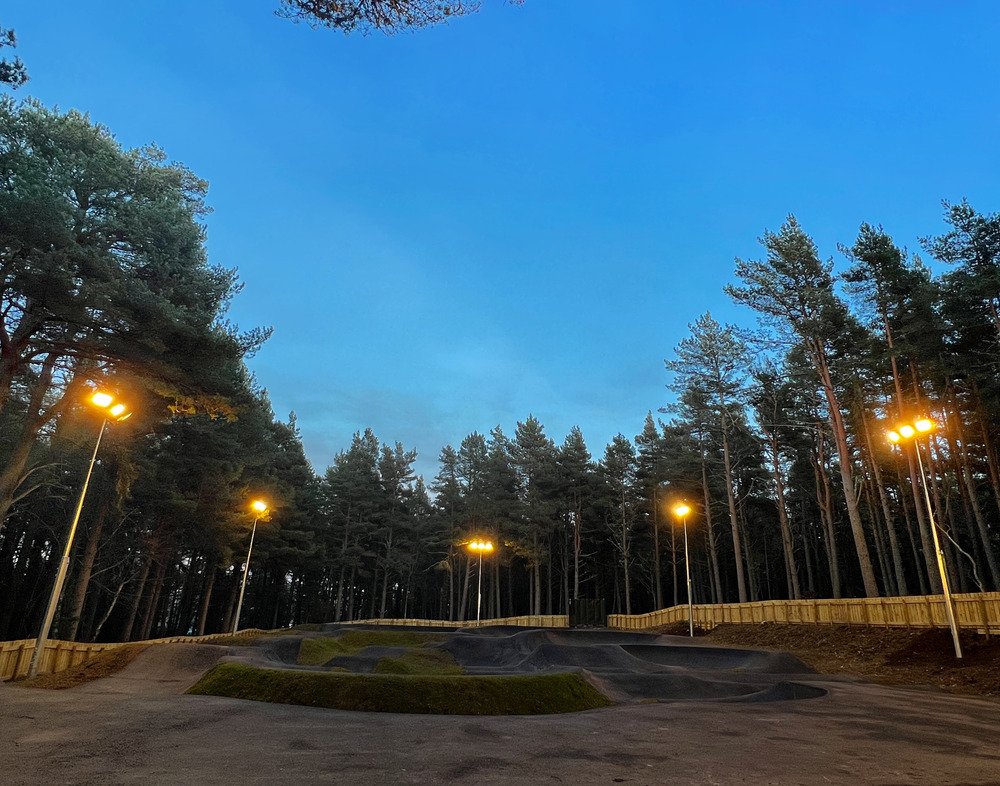 An outdoor sports facility under floodlights
